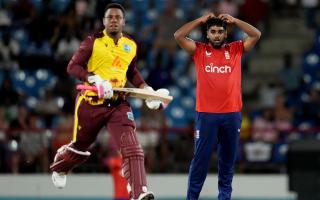 England’s bowler Rehan Ahmed reacts as West Indies’ Shimron Hetmyer runs during the fourth T20 cricket match at Daren Sammy National Cricket Stadium in Gros Islet, St Lucia (Ricardo Mazalan/AP)