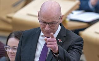 First Minister John Swinney's SNP have moved away from the Wellbeing Economic Approach