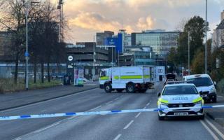 Specialist officers and a robot were pictured at the city centre travel hub