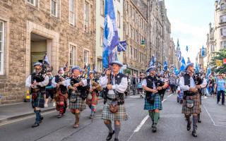 People take part in a Believe in Scotland march and rally in Edinburgh in 2023