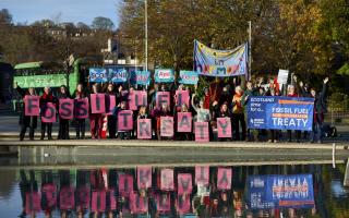 A demonstration was held outside the Scottish Parliament by climate campaigners