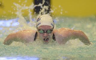 Keanna MacInnes broke the Scottish record in the women's 100-metre butterfly event