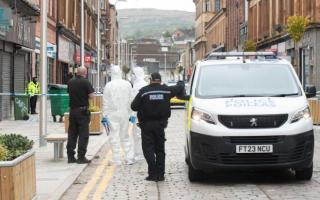 A 21-year-old man was found injured in a street on Saturday